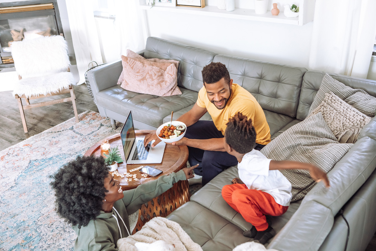 family sitting on the couch talking