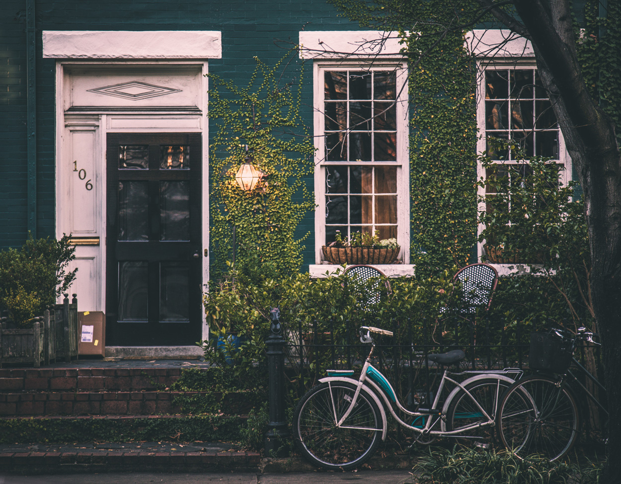 green house with plants and bicycles outside