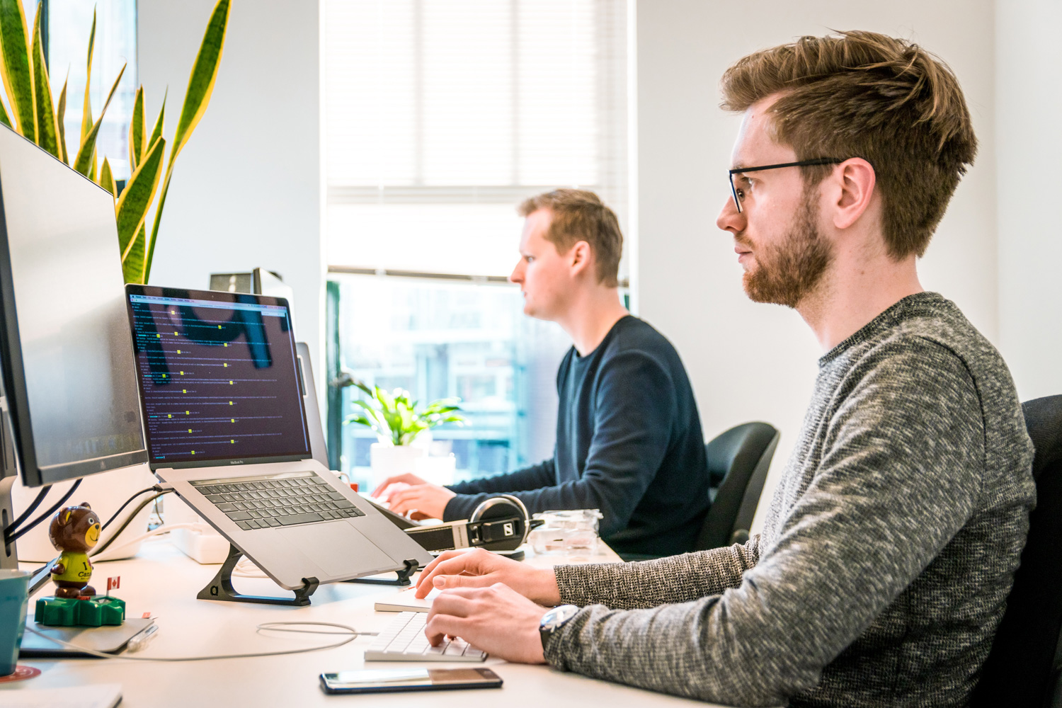 men working in the office on the computer