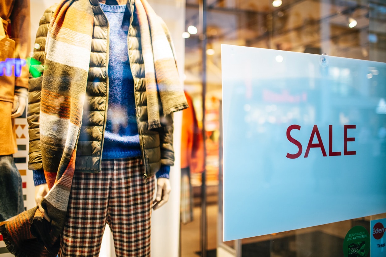 store with sale sign on the window