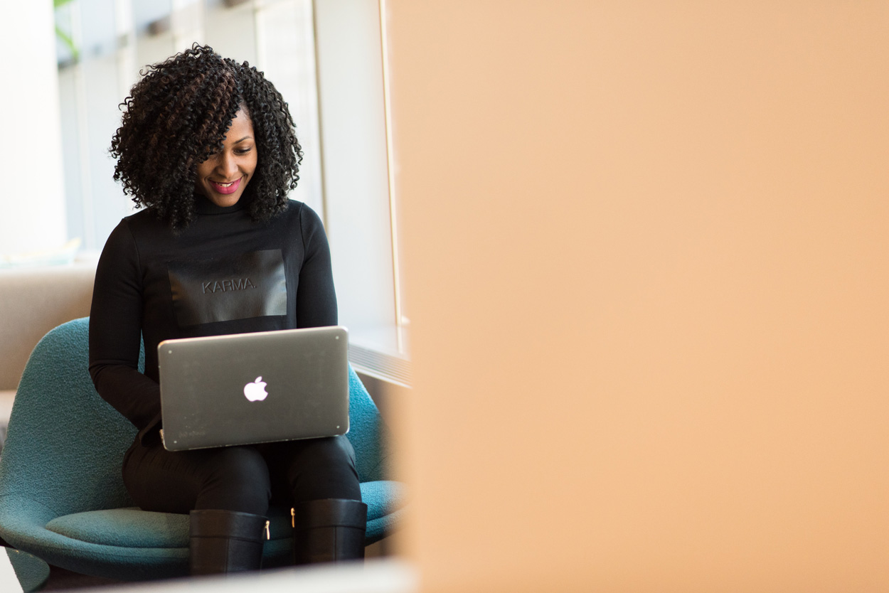 woman sitting using a laptop