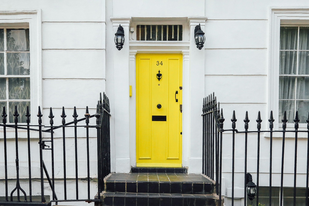 yellow door of home view from curb